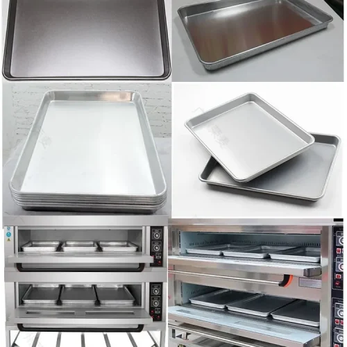 aluminum baking trays stacked and loaded in commercial deck oven
