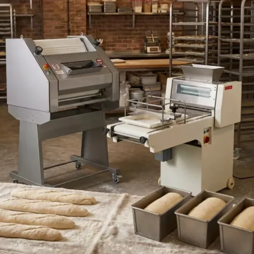 Shaped baguette loaves output from R&M RMZ-750 commercial baguette moulder