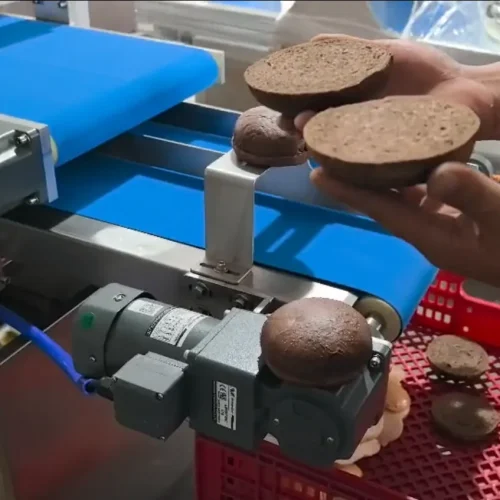 Burger bun slicer cutting operation dark brown buns sliced halves red crate CE motor