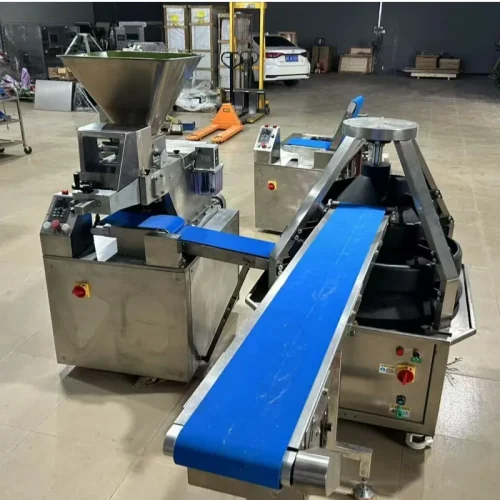 R&M continuous dough divider and conical rounder in factory production line operation
