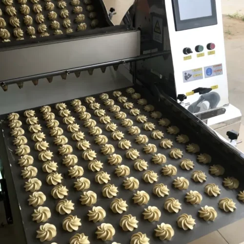 Cookie depositor forming consistent rows of patterned dough