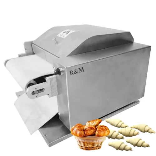 R&M croissant moulder machine with raw and baked croissants on white background