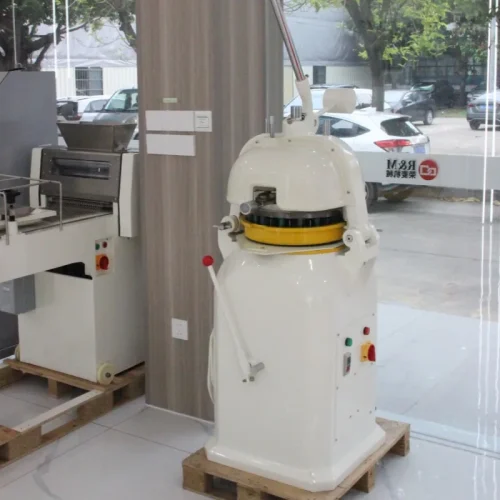 R&M semi-auto dough divider rounder in showroom with dough processing line