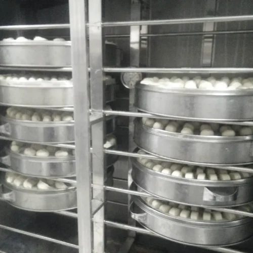 R&M spray proofer baozi and steam bun production round trays in cabinet