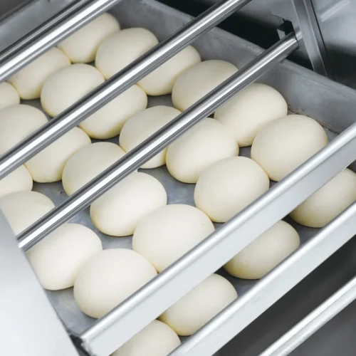 R&M spray type dough proofer dough balls on stainless steel trays