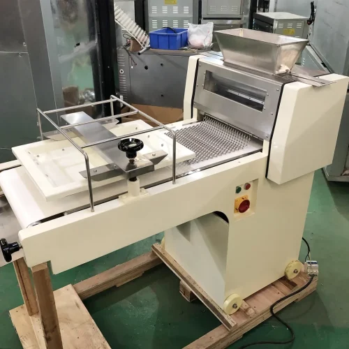 R&M RMZ-380 toast moulder on wooden pallet in workshop with casters