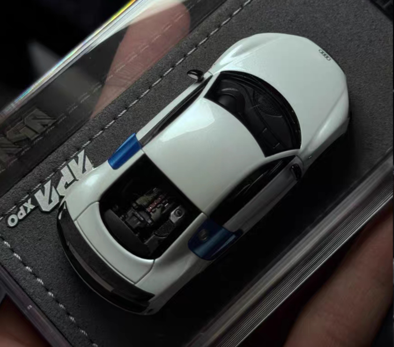 Top‑down shot GRYNING 1‑64 GT‑style collectible car